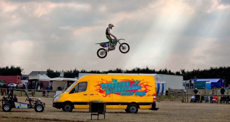 Motor bike jumping van - timing and aesthetics go together.